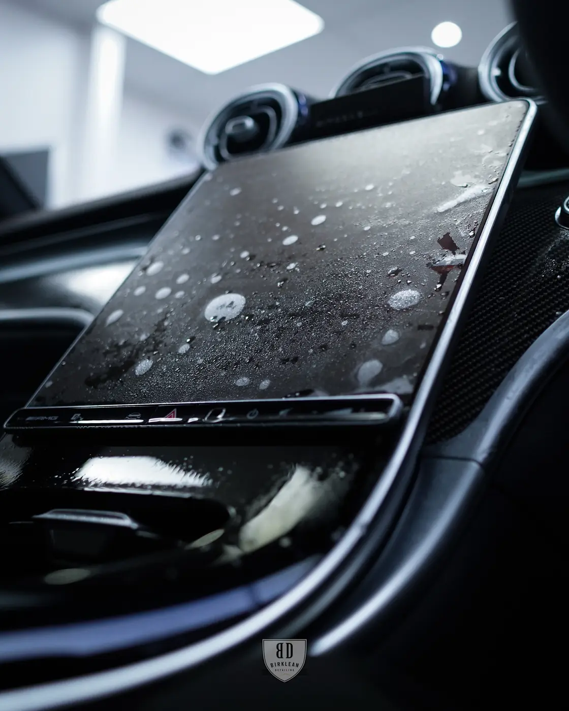 Interior PPF protecting gloss trim and touch surfaces in a new car